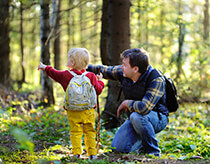 Father and child in forest image